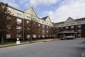 Gwynn Oak apartment for rent - an apartment building on a street with a car parked outside
