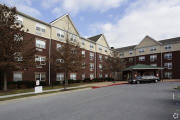 Gwynn Oak apartment for rent - an apartment building on a street with a car parked outside