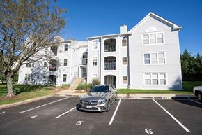 Annapolis house for rent - a car parked in front of an apartment building