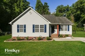 Kannapolis house for rent - a small white house with blue shutters and a front yard