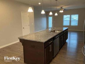 Locust house for rent - an empty kitchen with a counter top and a sink