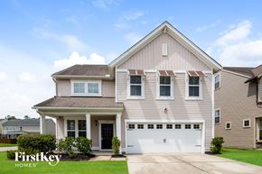Moncks Corner house for rent - a beige house with a white garage door