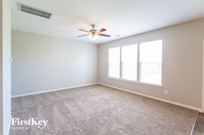 Moncks Corner house for rent - a living room with a ceiling fan and a large window