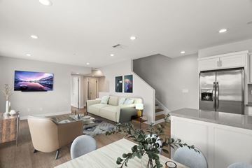 North Hollywood apartment for rent - a living room with a couch and a table