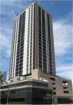Honolulu apartment for rent - a tall building with a blue sky in the background
