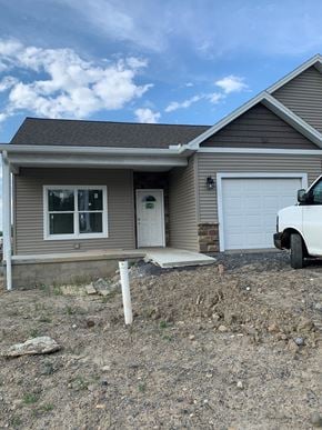 Penn Yan apartment for rent - a house with a white truck parked in front of it