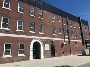 Winnipeg apartment for rent - a brick building with an arched door