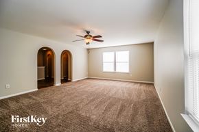 Blacklick house for rent - an empty living room with a ceiling fan and a carpet