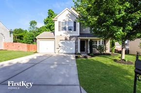 Mount Holly house for rent - A house with a white garage door is for sale.