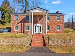 Collinsville apartment for rent - A red brick house with a white door and windows.