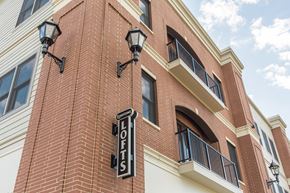 Williamsville apartment for rent - a brick building with a sign on the side of it