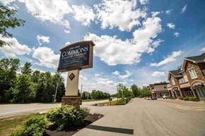 East Amherst apartment for rent - the sign at the end of the street in front of a building