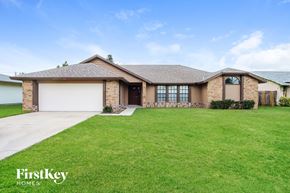 Palm Bay house for rent - a house with a lawn in front of it