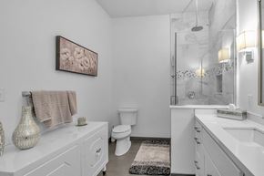 Amherst apartment for rent - a white bathroom with a shower and a toilet