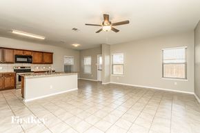 Princeton house for rent - an empty kitchen and living room with a ceiling fan