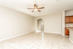 Princeton house for rent - a clean and empty living room with a ceiling fan