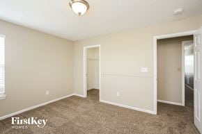 Greenfield house for rent - a bedroom with carpet and a door to a closet