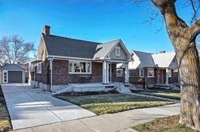 Salt Lake City house for rent - a brick house with a sidewalk in front of it