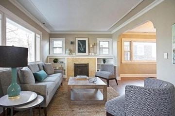 Salt Lake City house for rent - a living room with a couch and chairs and a fireplace