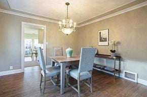 Salt Lake City house for rent - a dining room with a table and chairs and a chandelier