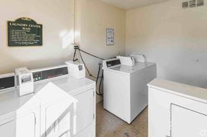 Westminster apartment for rent - a laundry room with three washers and three washing machines