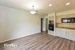 Humble house for rent - the kitchen and living room of an empty house