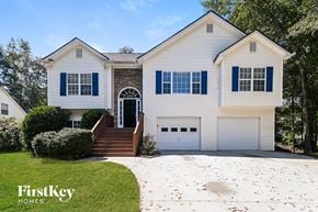 Temple house for rent - a white house with blue shutters and a white driveway