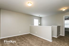 Landis house for rent - the living room and dining room with carpeted floors and white walls