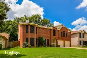 Cedar Hill house for rent - a large brick house with a lawn in front of it