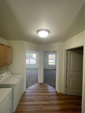 Weston apartment for rent - an empty kitchen with a door to a living room