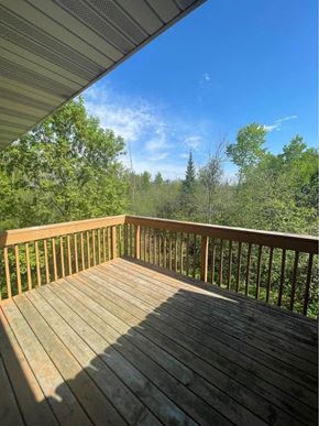 Weston apartment for rent - the view from the deck of a cabin with trees
