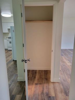 Weston apartment for rent - A room with a wooden floor and a white door.