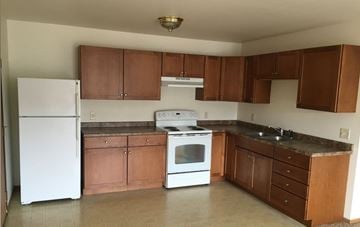 Kronenwetter apartment for rent - A kitchen with white appliances and brown cabinets.