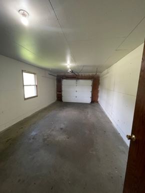 Wausau apartment for rent - A room with a white ceiling, a window, a door, and a concrete floor.