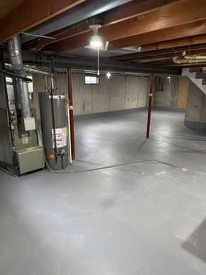 Wausau apartment for rent - A spacious basement with a concrete floor and a concrete wall.