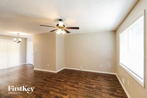 Conyers house for rent - a living room with wood flooring and a ceiling fan
