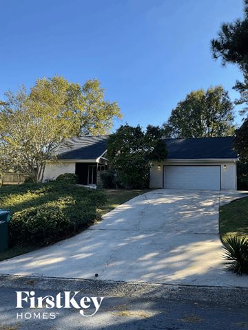 Riverdale house for rent - a house with a driveway and a garage door