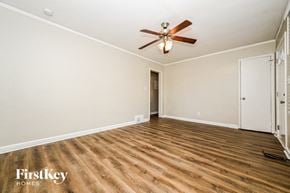 Decatur house for rent - a living room with hardwood floors and a ceiling fan