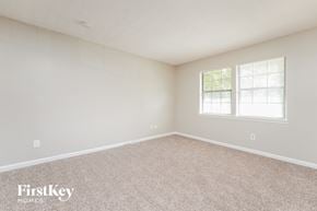 Lithonia house for rent - an empty bedroom with a window and carpet
