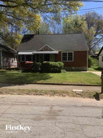 East Point house for rent - a small brick house on the side of a street