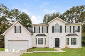 Decatur house for rent - a white house with black shutters and a lawn
