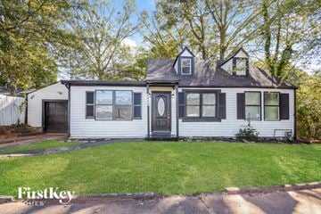 Atlanta house for rent - a white house with black shutters and a lawn
