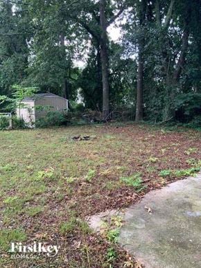 College Park house for rent - a yard with a shed and some trees