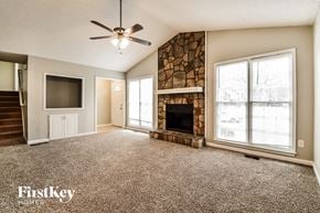 Marietta house for rent - A spacious living room with a fireplace and a flat screen TV.