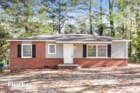 Atlanta house for rent - a small brick house with a white door and windows
