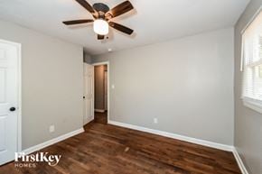 Atlanta house for rent - a living room with a ceiling fan and wood flooring