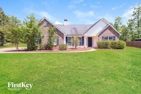 Mcdonough house for rent - a home with a large yard and grass