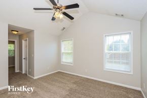 Mcdonough house for rent - the living room of a home with a ceiling fan