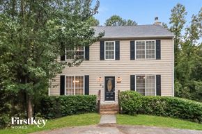 Acworth house for rent - a home with black shutters and a black front door