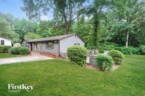 Red Oak house for rent - a small white house with a yard and a driveway